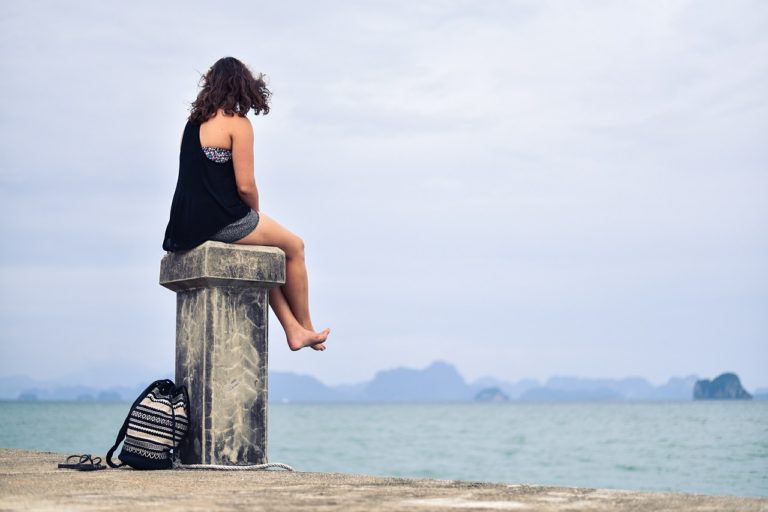 Lonely person by water