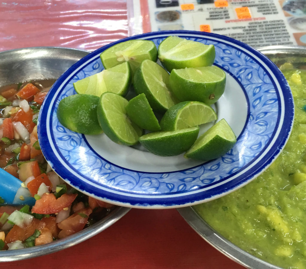 Limes, guacamole and fresh salsa