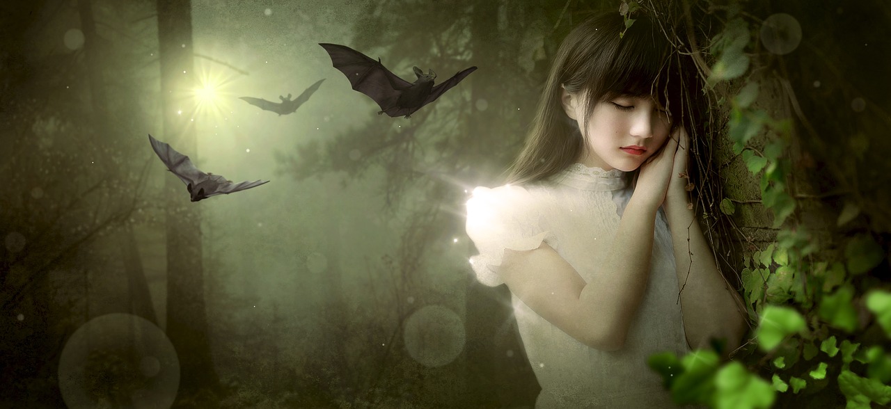 Girl in forest with bats